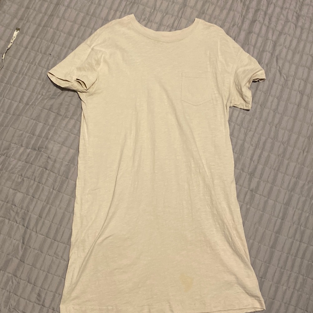 Knee length cream dress.